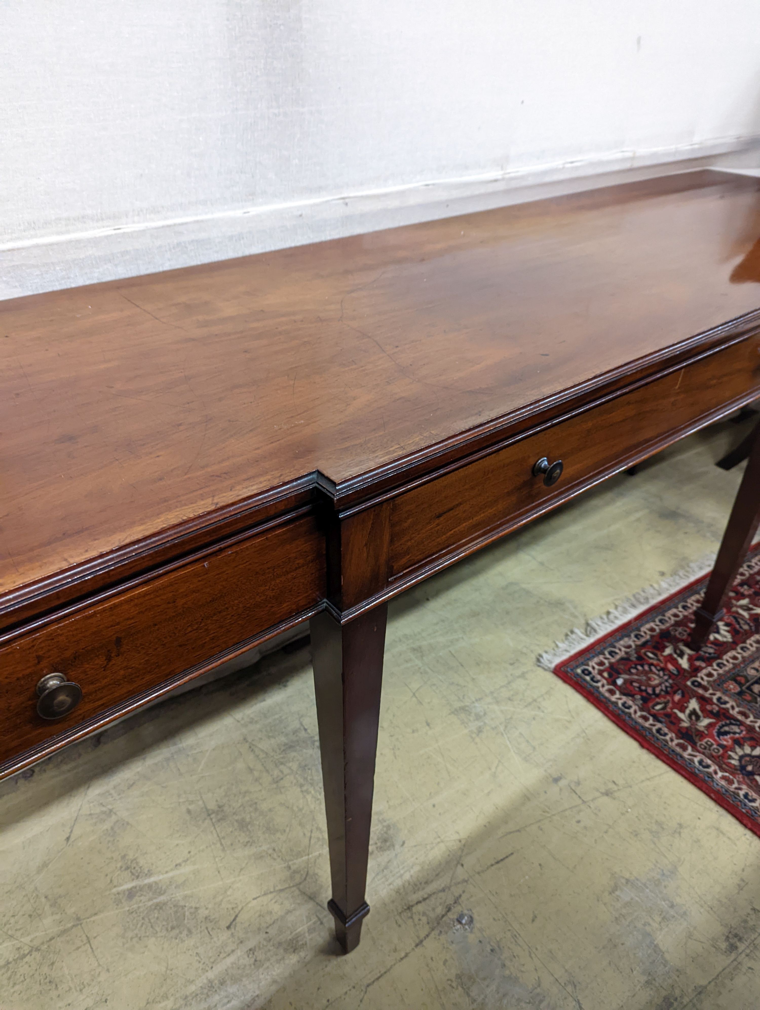 An Edwardian mahogany break front serving table by Howard & Son, London, width 214cm, depth 60cm, height 85cm